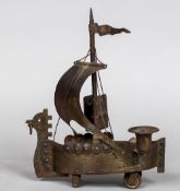 A German Arts & Crafts steel smoker's compendium formed as a Viking ship Together with a pair of