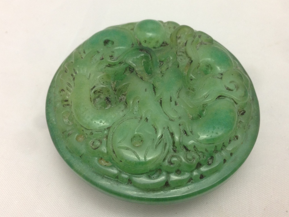 A Chinese carved jade belt hook Of circular form, carved with a dragon. 5.5 cm diameter. - Image 3 of 6