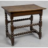 An 18th century oak side table The rectangular top above the plain frieze,