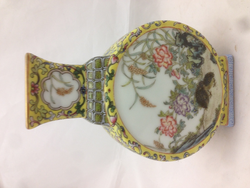 A Chinese porcelain moon flask Decorated with bird vignettes within lotus strapwork on a yellow - Image 4 of 10