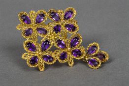 An Italian 18K gold amethyst set pendant brooch Of pierced floral form. 7.5 cm high.