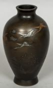 A white and yellow metal inlaid bronze vase Worked with cranes above a continuous landscape,