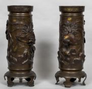 A pair of 19th century Oriental patinated bronze vases Of cylindrical form,