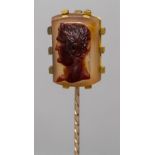 A Victorian unmarked gold stick pin Set with a finely carved agate cameo depicting a classical male