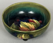 A William Moorcroft pottery bowl Decorated with the Leaf and Berries pattern,