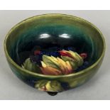 A William Moorcroft pottery bowl Decorated with the Leaf and Berries pattern,