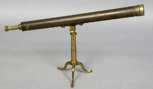 A 19th century lacquered brass table telescope Supported on a tripod stand. 100 cm long.