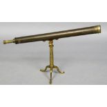 A 19th century lacquered brass table telescope Supported on a tripod stand. 100 cm long.