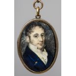 A late 18th/early 19th century miniature portrait on ivory Depicting a young gentleman in a blue