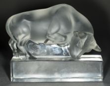 A Lalique frosted glass model of a bull Standing on a plinth base, signed. 8.5 cm high.