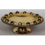 A Victorian gilt metal agate set tazza With engraved decoration. 30.5 cm diameter.