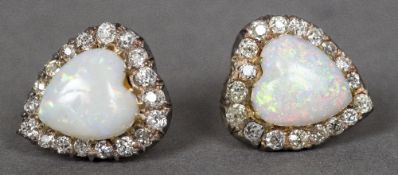 A pair of 9 ct gold diamond and opal ear studs Each of heart shape. 1.5 cm high.