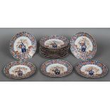A set of twelve 18th century Imari dishes Each decorated with a floral filled border centred with a