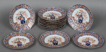 A set of twelve 18th century Imari dishes Each decorated with a floral filled border centred with a