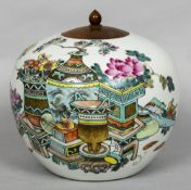 A Chinese porcelain ginger jar and wood cover Decorated with precious objects opposing calligraphic