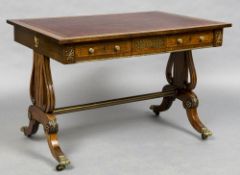 An early 19th century ormolu mounted brass inlaid mahogany library table The gilt tooled leather