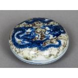 A Chinese porcelain circular box and cover Decorated with dragons chasing a flaming pearl,