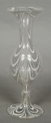 A Venetian Art glass vase Of slender baluster form with trailed white decoration. 20.5 cm high.