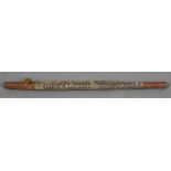 An Aboriginal pipe Of elongated tubular form with painted decorations. 55 cm long.