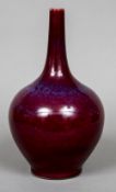 A Chinese porcelain baluster bottle vase With allover sang-de-boeuf f glaze,