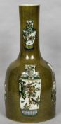 A Chinese porcelain mallet vase With speckled green background decorated in the round with