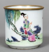 A Chinese porcelain beaker Decorated with a female figure seated in a continuous garden landscape.