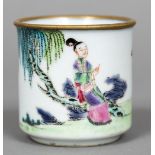 A Chinese porcelain beaker Decorated with a female figure seated in a continuous garden landscape.