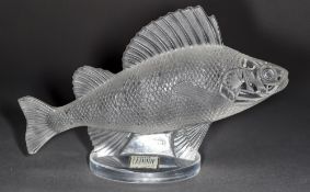 A Lalique glass paperweight modelled as a perch Engraved Lalique France and with original paper