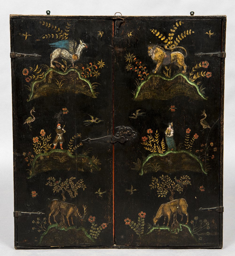 An 18th century chinoiserie lacquered hanging cabinet Of slender form with twin doors,