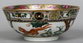 A Chinese porcelain bowl Decorated in the round with a dog-of-fo, birds and calligraphic roundels.