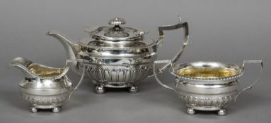 A matched George III Scottish silver tea set, hallmarked Edinburgh 1813,