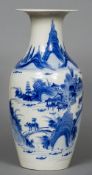 A 19th century Chinese blue and white baluster vase Decorated with figures and pagodas amongst a