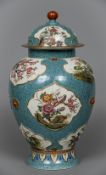 A Chinese porcelain baluster vase and cover Decorated with floral vignettes incorporating insects