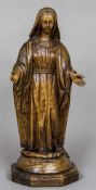 An 18th century carved wooden model of the Madonna Typically modelled, standing in flowing robes,