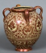 A Hispano-Moresque vase Copper lustre decorated with stylised flowerheads and scrolls and with four