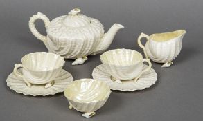 A second period Belleek Neptune tea set for two Comprising: teapot and cover, cream jug,