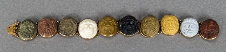 A 19th century carved lava inset 9 ct gold bracelet Set with ten classical bust roundels.