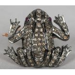 An unmarked white and yellow metal diamond and ruby set brooch Modelled as a frog. 3.5 cm wide.