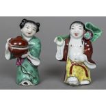 Two 19th century Chinese porcelain incense stick holders One formed as a partially robed man