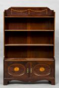 An Edwardian inlaid mahogany bookcase The three quarter galleried top inlaid with trailing husks