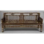 A 19th century Chinese mother-of-pearl inlaid hardwood bench The pierced and turned back and arms