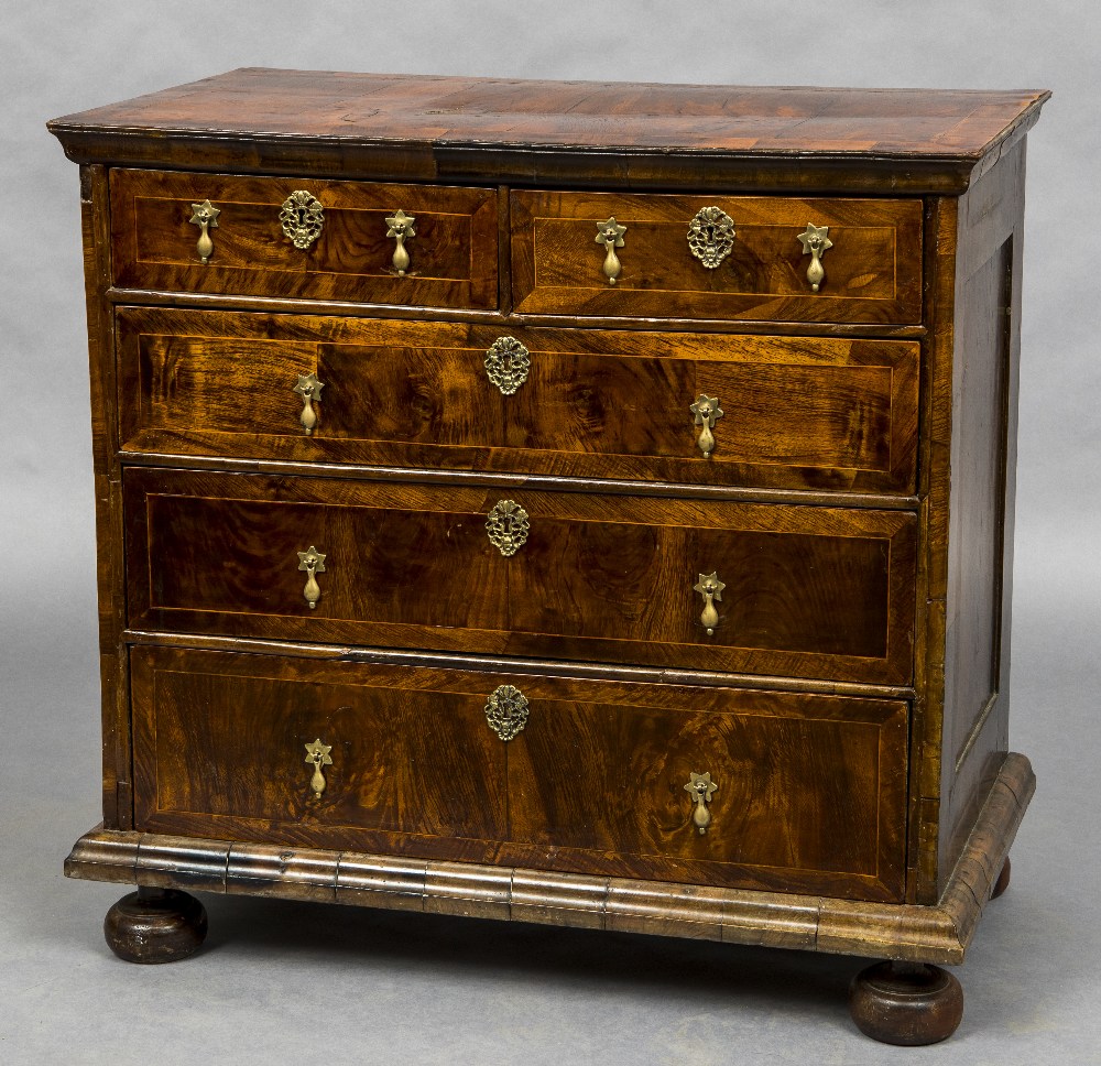 An 18th century walnut chest of drawers The crossbanded moulded rectangular top above an