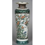 A 19th century Japanese porcelain vase Decorated with a bird amongst floral sprays,