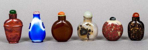 Six various Chinese glass and hardstone snuff bottles Each with cabochon stoppers. The largest 6.