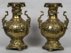 A pair of 19th century Chinese bronze vases Each decorated in relief with chrysanthemums,