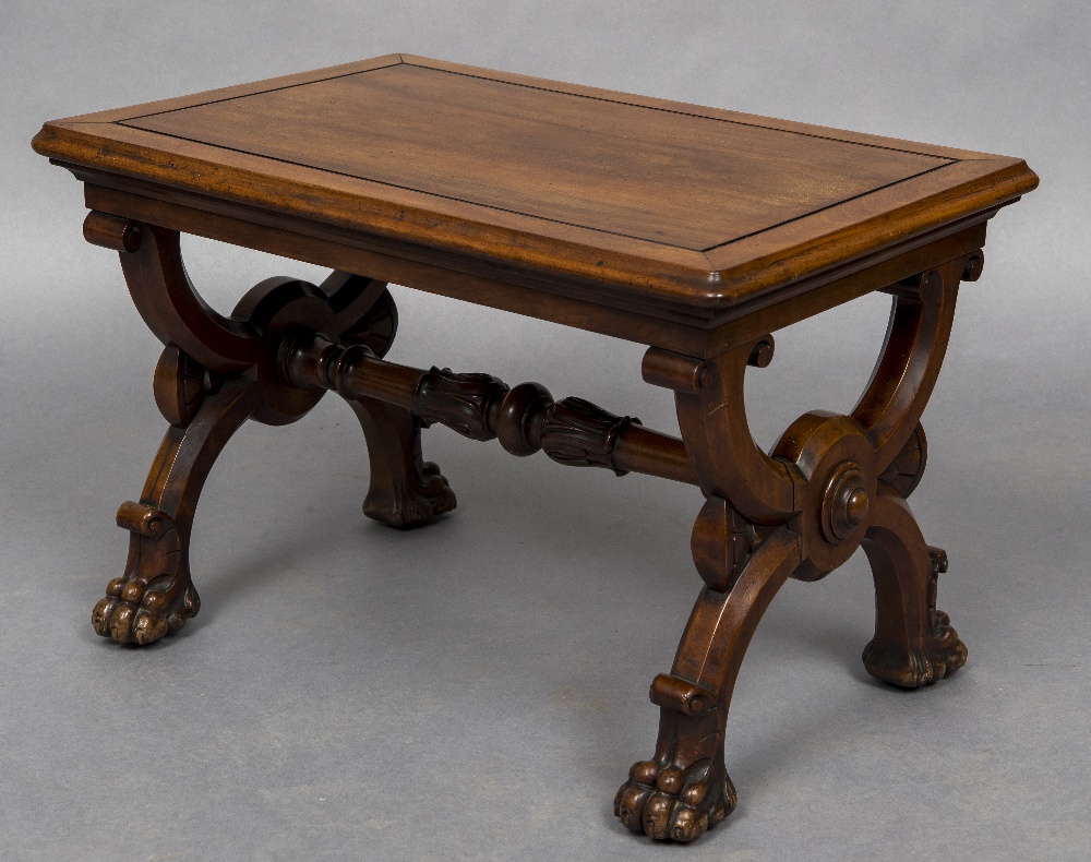 A 19th century mahogany X-framed stool The panelled rectangular top above the scrolling X-frame