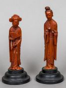 Two Chinese cinnabar lacquer figures of women One holding a fan and a scroll,