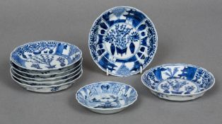 A set of seven small 18th century Chinese blue and white dishes Each decorated with vignettes of