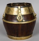 A 19th century brass mounted wooden pail, possibly yewwood With iron and brass coopering.
