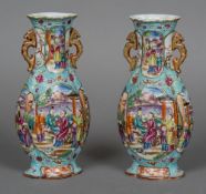 A pair of small 19th century Canton vases Each of lobed form with twin scrolling dragon handles and